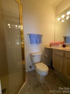 19 Lookout Loop Burnsville, NC 28714 - Photo 27 of 30 a bathroom with a toilet a sink and mirror