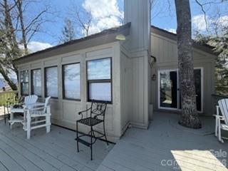 19 Lookout Loop Burnsville, NC 28714 - Photo 3 of 30 a view of a patio with table and chairs and wooden floor