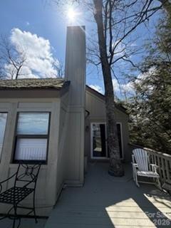 19 Lookout Loop Burnsville, NC 28714 - Photo 7 of 30 a backyard of a house with table and chairs