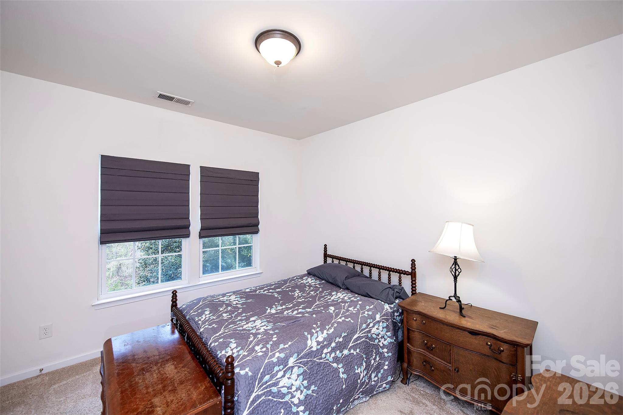 1957 Faison Avenue Fort Mill, SC 29708 - Photo 15 of 33 a bed sitting in a bedroom next to a window
