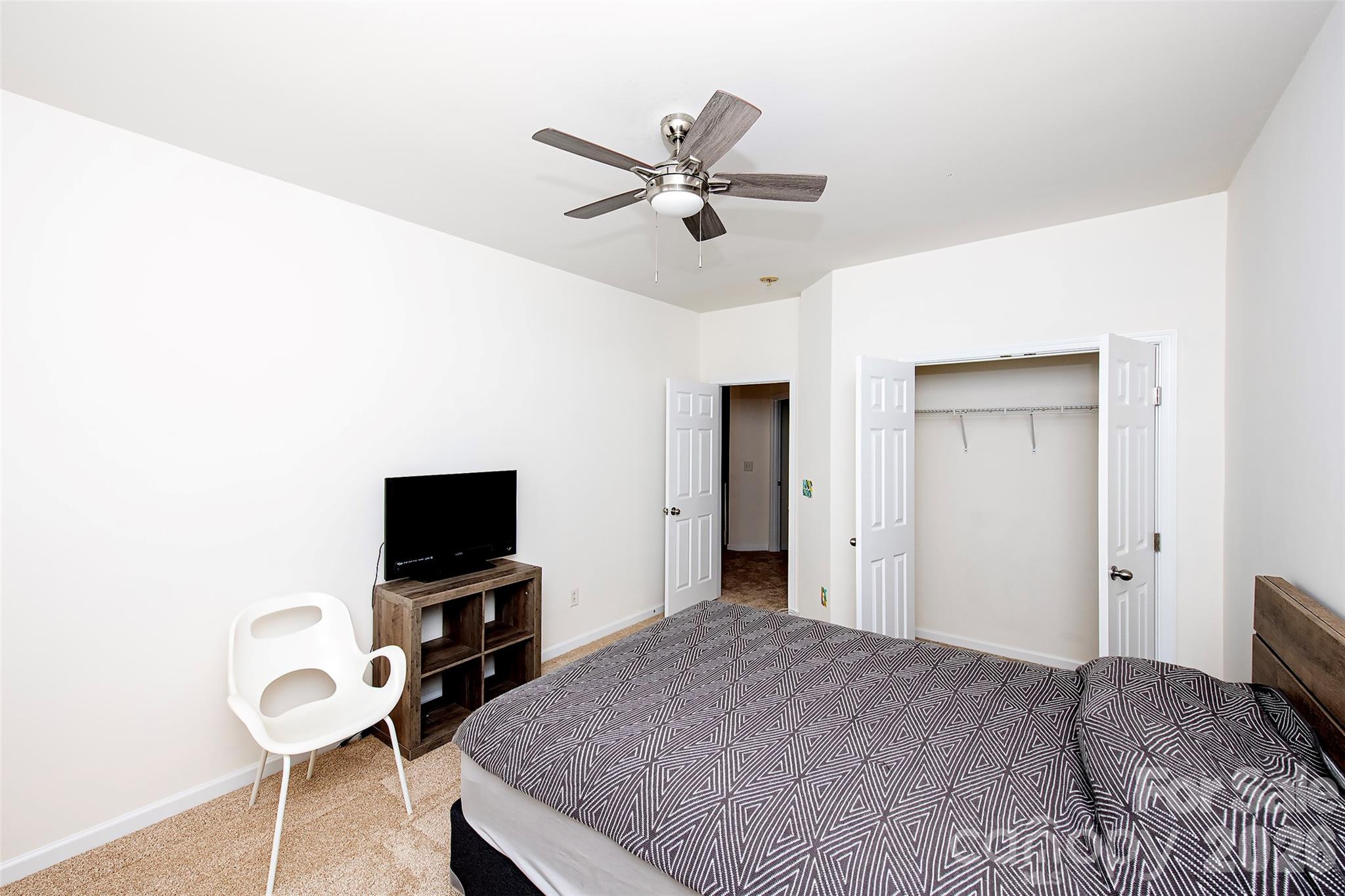 1957 Faison Avenue Fort Mill, SC 29708 - Photo 18 of 33 a bedroom with a bed and a flat screen tv