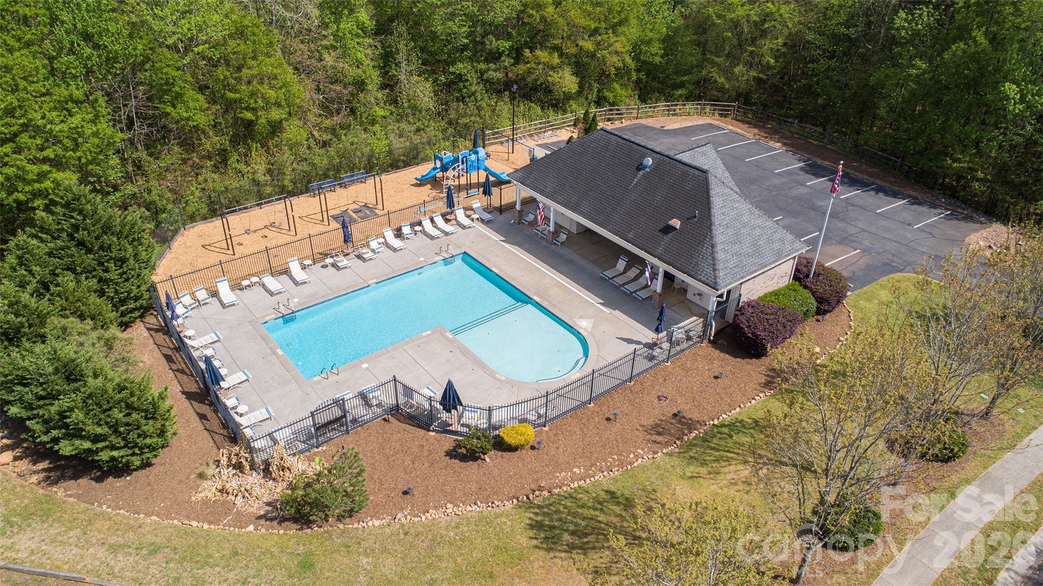 1957 Faison Avenue Fort Mill, SC 29708 - Photo 30 of 33 an aerial view of a house with a swimming pool a yard and a fountain