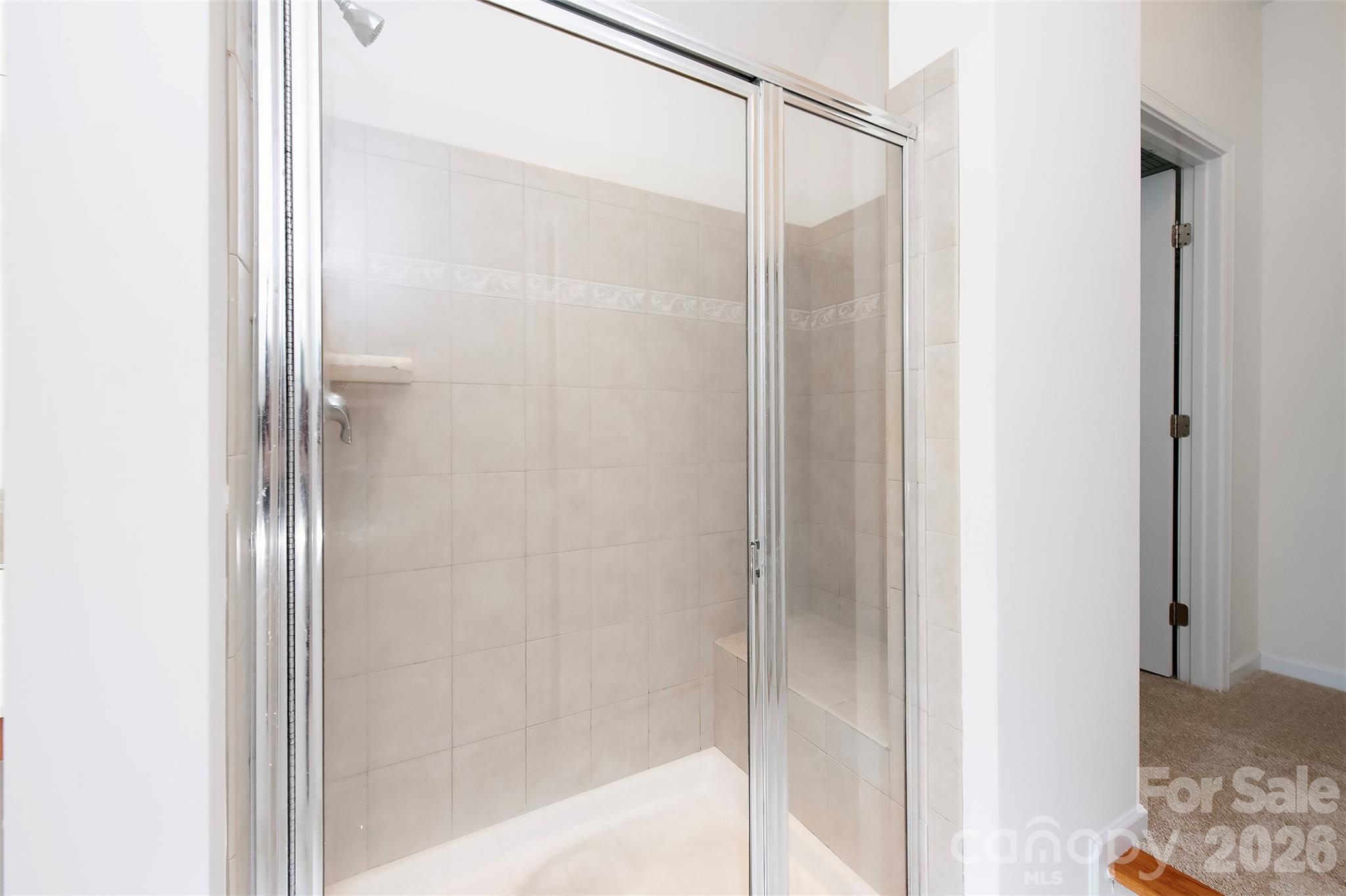1957 Faison Avenue Fort Mill, SC 29708 - Photo 33 of 33 a bathroom with a glass shower door