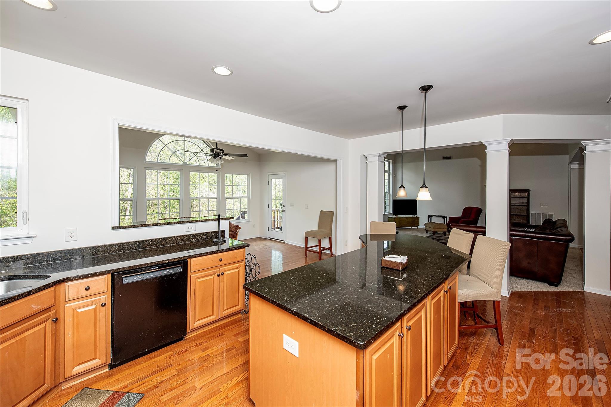 1957 Faison Avenue Fort Mill, SC 29708 - Photo 9 of 33 a kitchen with granite countertop kitchen island stainless steel appliances a sink stove and refrigerator