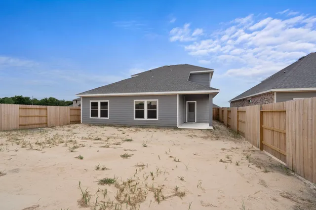 a big house with a large tree in front of it