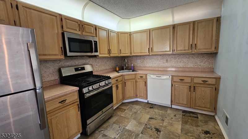 501 Red Crest Lane Somerville, NJ 08876 - Photo 11 of 24 a kitchen with a stove microwave and sink