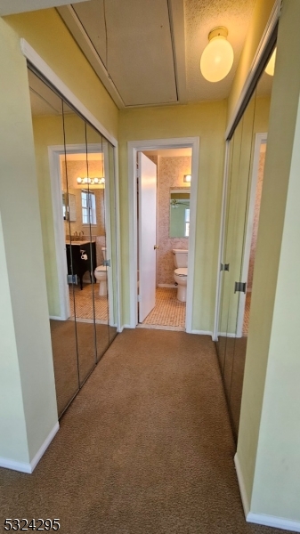 501 Red Crest Lane Somerville, NJ 08876 - Photo 14 of 24 a view of a hallway with wooden floor and a cabinet