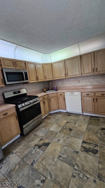 501 Red Crest Lane Somerville, NJ 08876 - Photo 10 of 24 a kitchen with granite countertop a stove and a sink