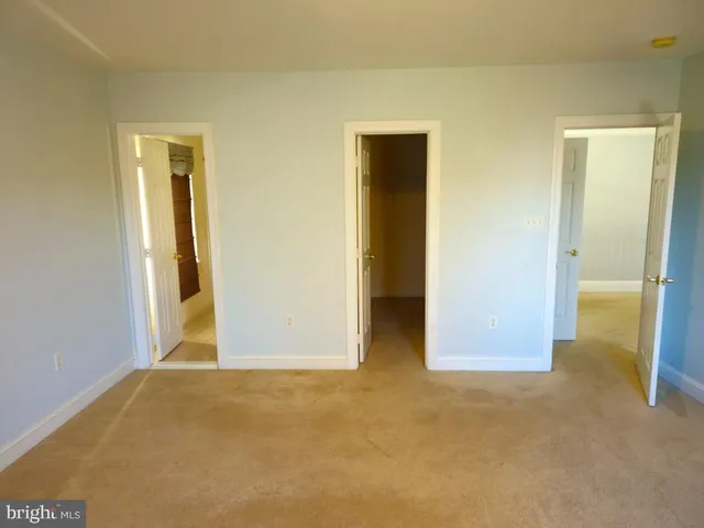 a bathroom with a shower a toilet and a sink