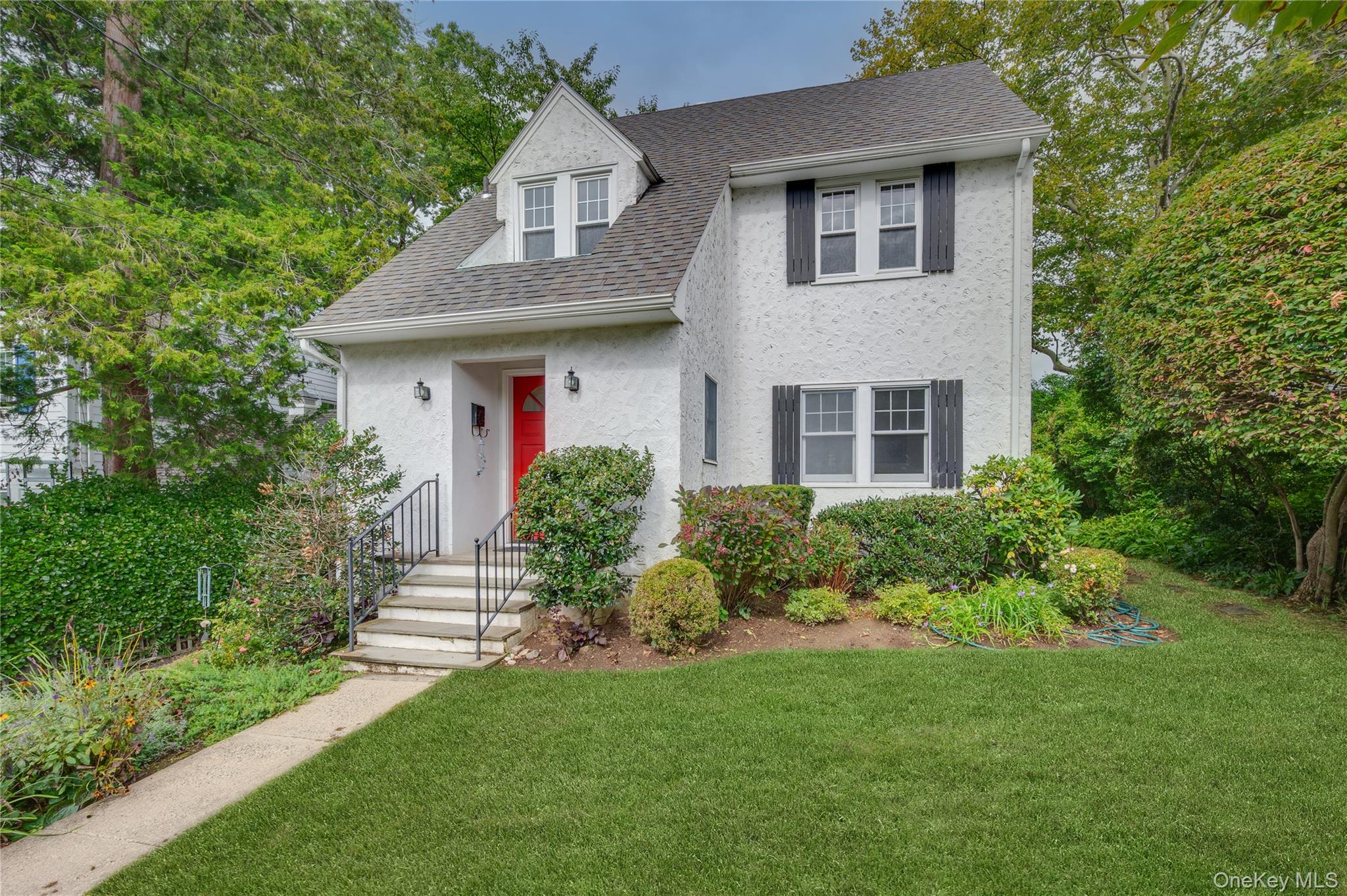 17 Briarcliff Road Larchmont, NY 10538 - Photo 1 of 1 a front view of a house with a yard