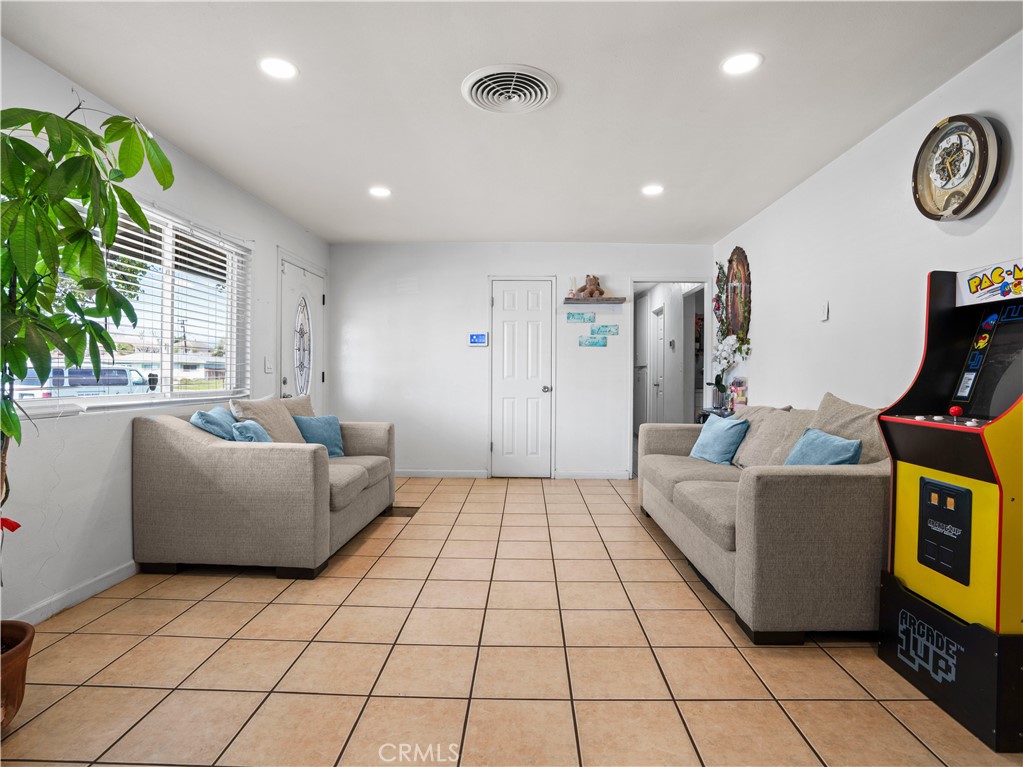1455 North Alice Avenue Rialto, CA 92376 - Photo 10 of 23 a living room with a couch and a table