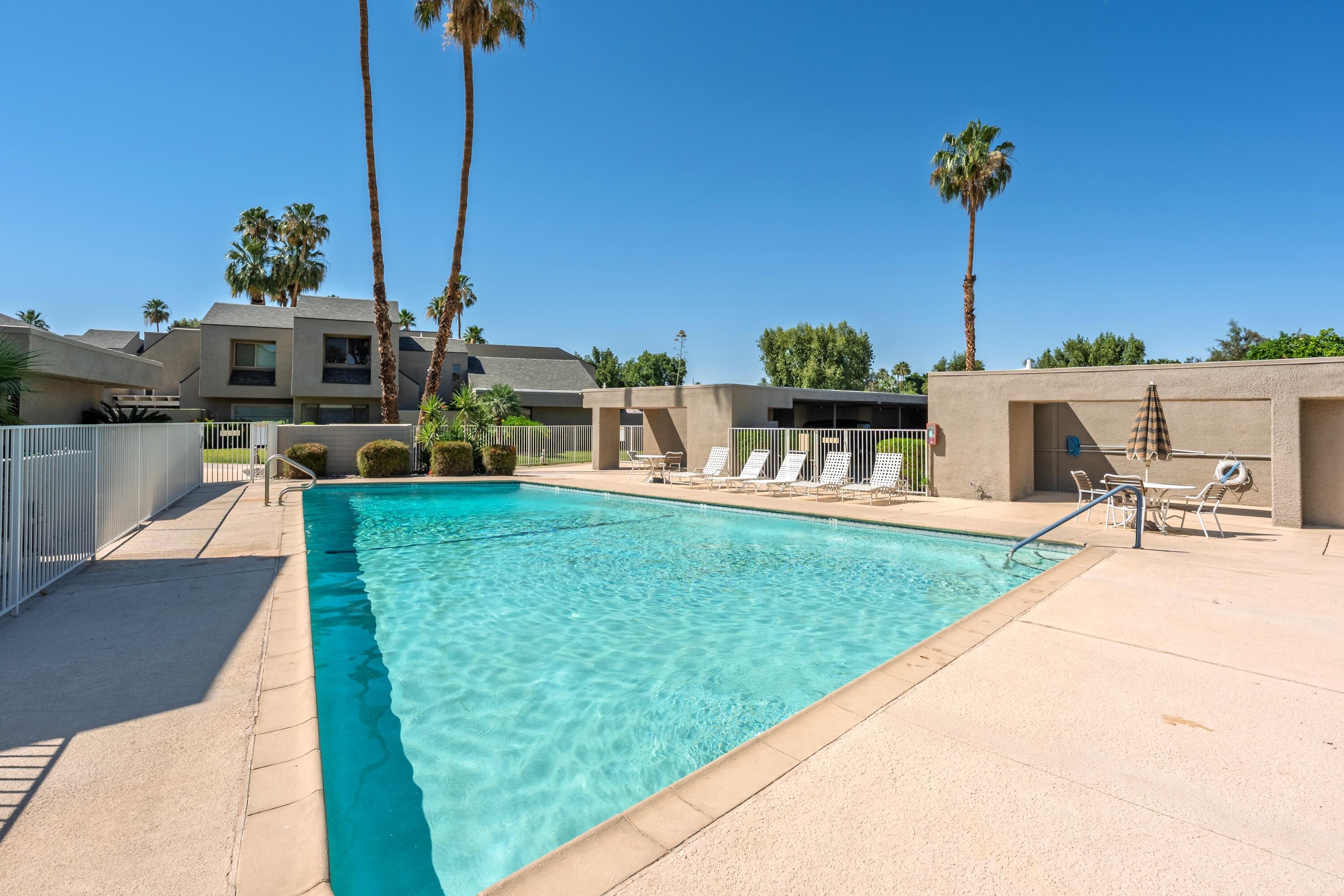 71870 Eleanora Lane Rancho Mirage, CA 92270 - Photo 29 of 36 a view of a house with a big yard and a porch