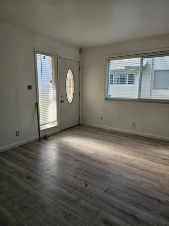 a view of a livingroom with wooden floor