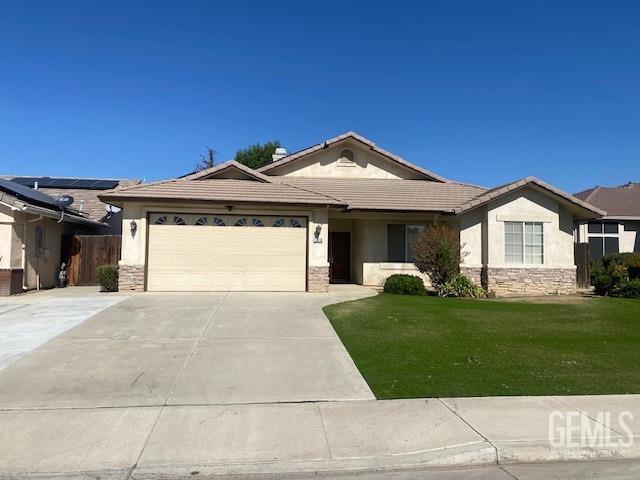 Undisclosed Address Bakersfield, CA 93312 - Photo 1 of 19 a front view of a house with a yard