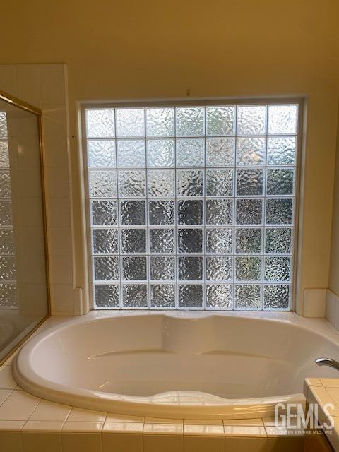Undisclosed Address Bakersfield, CA 93312 - Photo 13 of 19 a view of bath tub sitting in a room