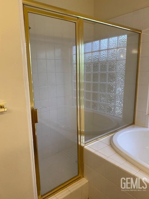 Undisclosed Address Bakersfield, CA 93312 - Photo 14 of 19 a bathroom with a shower and a sink