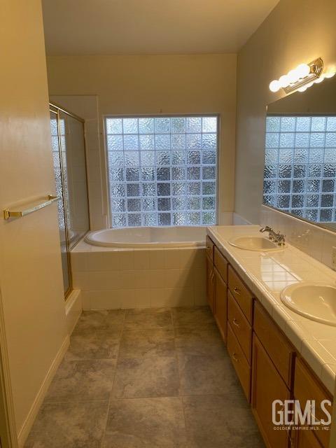 Undisclosed Address Bakersfield, CA 93312 - Photo 15 of 19 a bathroom with a bathtub and a sink