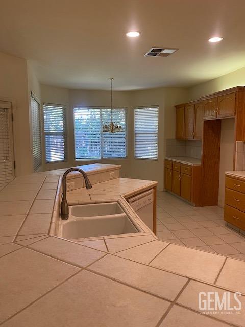 Undisclosed Address Bakersfield, CA 93312 - Photo 4 of 19 a kitchen with stainless steel appliances granite countertop a sink and a refrigerator