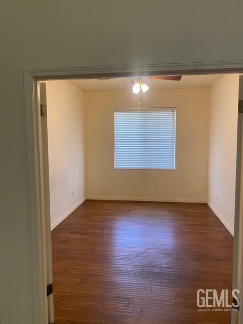 Undisclosed Address Bakersfield, CA 93312 - Photo 5 of 19 a view of an empty room with wooden floor and a window