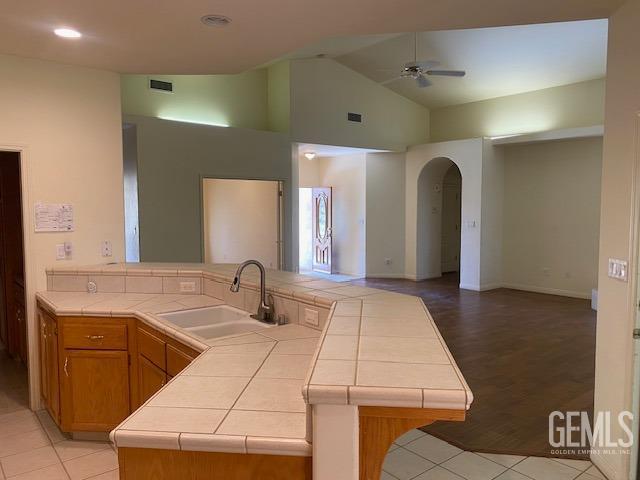 Undisclosed Address Bakersfield, CA 93312 - Photo 7 of 19 a bathroom with a sink and a mirror
