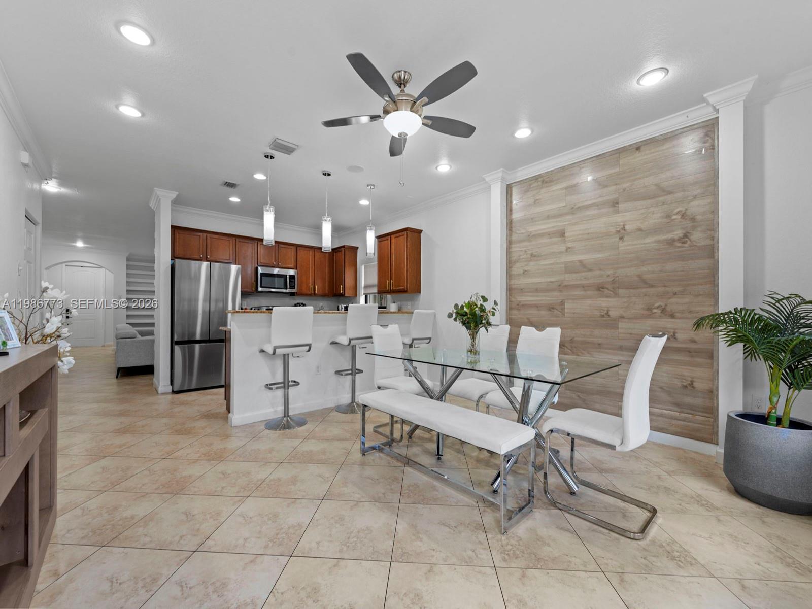 15404 Southwest 175th Street Miami, FL 33187 - Photo 13 of 38 a living room with furniture and kitchen view