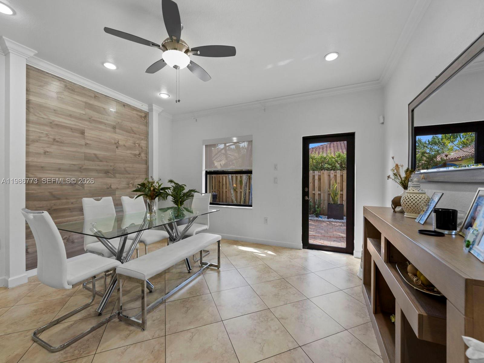 15404 Southwest 175th Street Miami, FL 33187 - Photo 14 of 38 a living room with furniture and a flat screen tv
