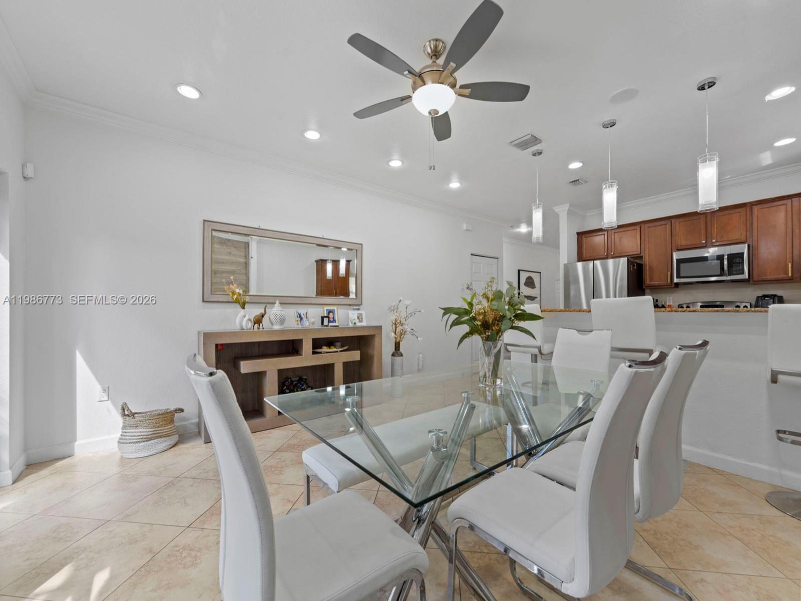 15404 Southwest 175th Street Miami, FL 33187 - Photo 15 of 38 a view of a dining room with furniture