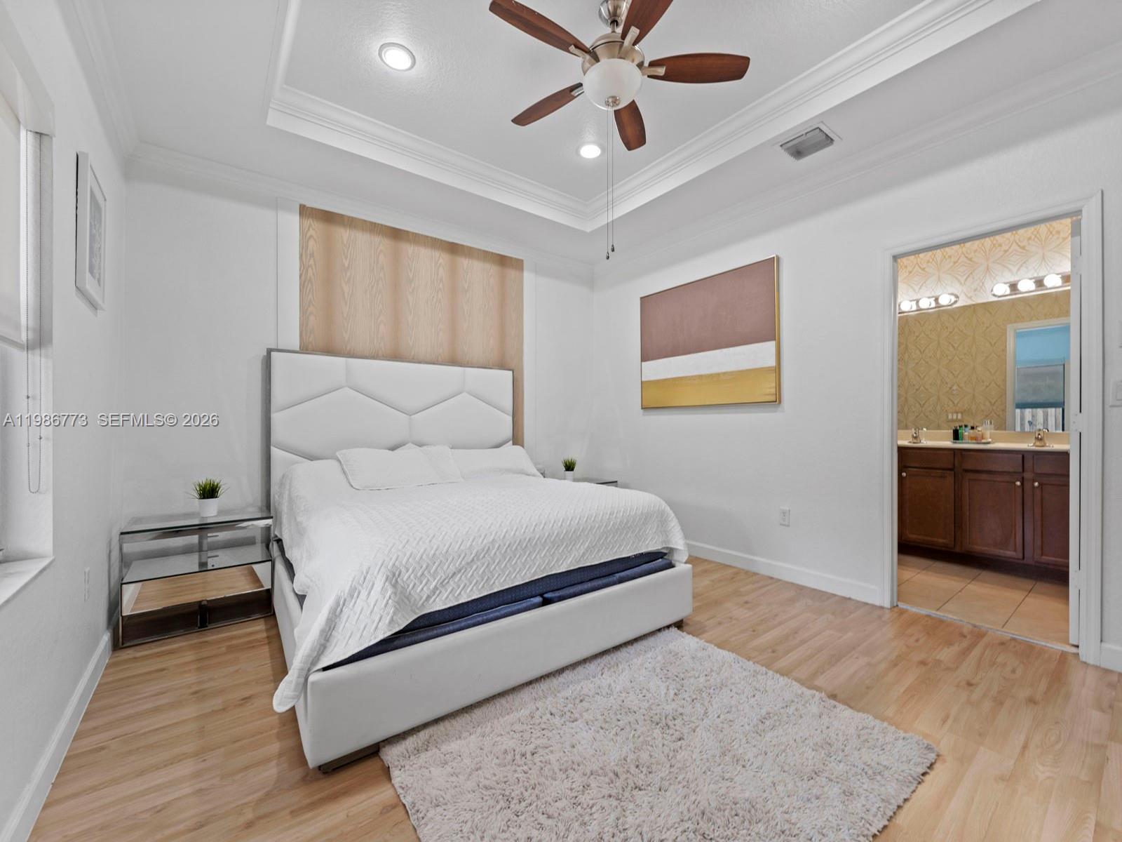 15404 Southwest 175th Street Miami, FL 33187 - Photo 16 of 38 a bedroom with a bed and a view