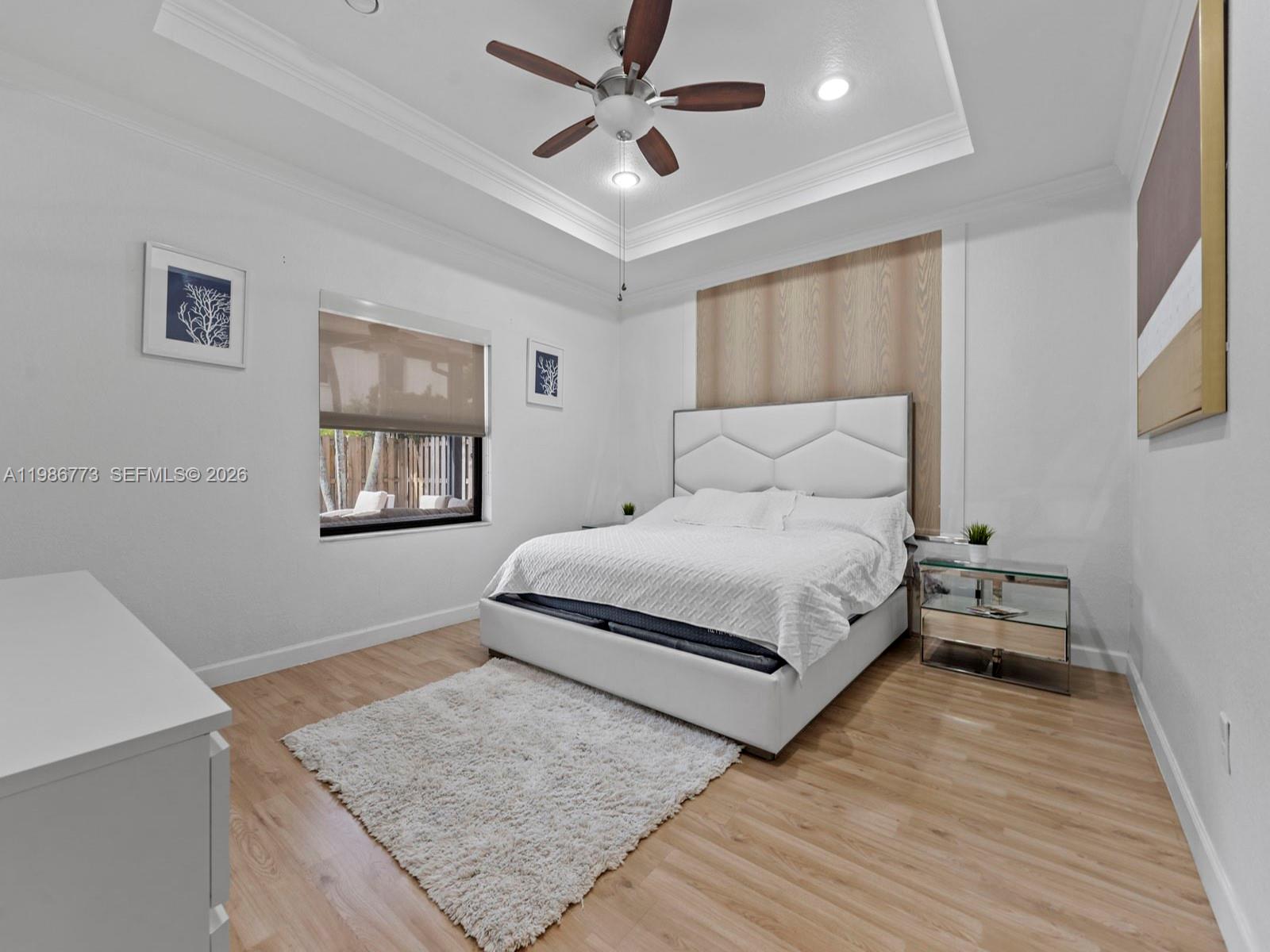 15404 Southwest 175th Street Miami, FL 33187 - Photo 17 of 38 a bedroom with a bed and a dresser