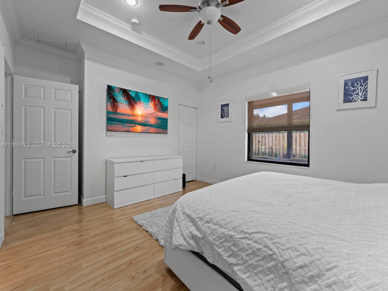 15404 Southwest 175th Street Miami, FL 33187 - Photo 18 of 38 a bedroom with a bed and a window