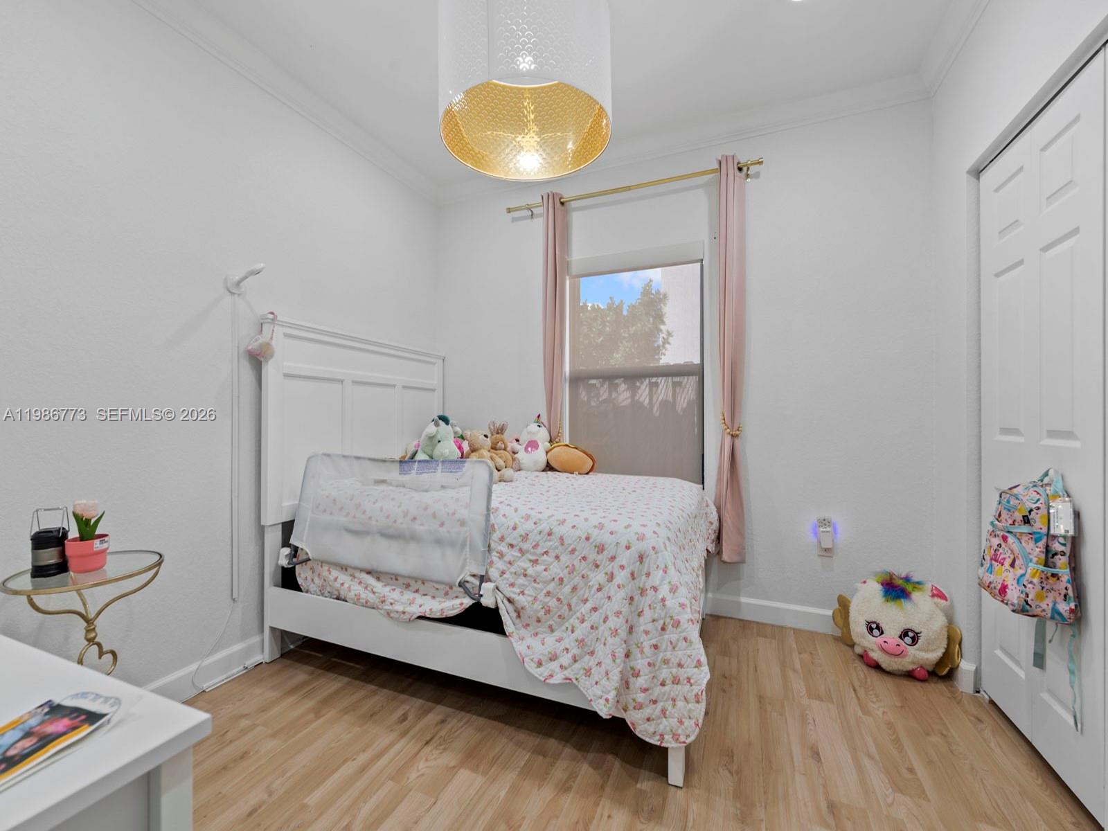 15404 Southwest 175th Street Miami, FL 33187 - Photo 22 of 38 a bedroom with a bed and a window