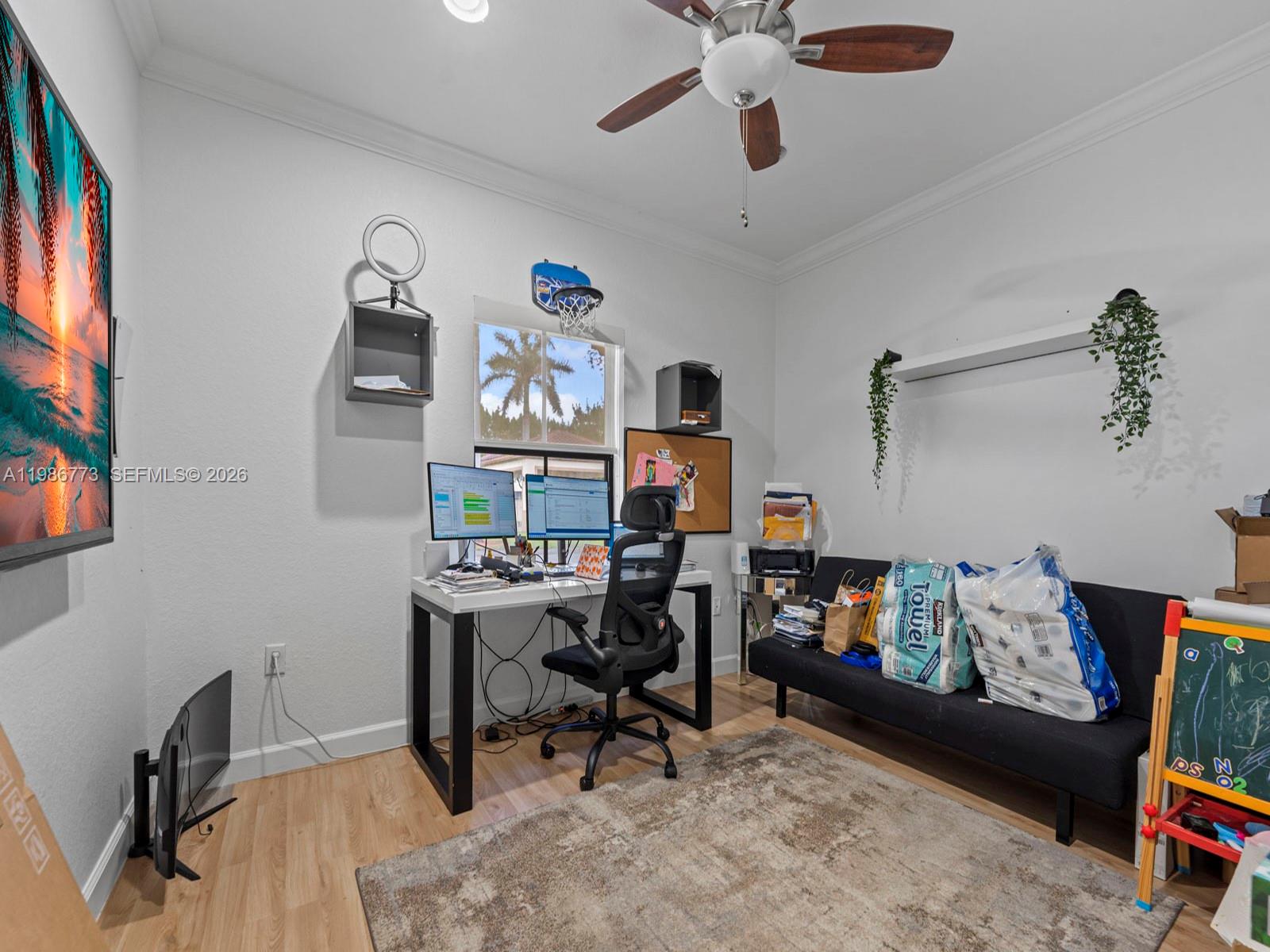15404 Southwest 175th Street Miami, FL 33187 - Photo 24 of 38 a view of a workspace with furniture and a window