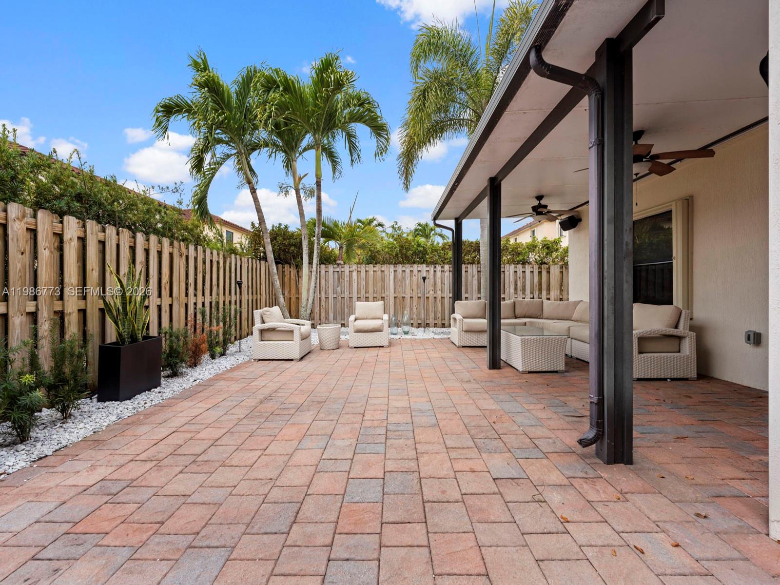 15404 Southwest 175th Street Miami, FL 33187 - Photo 27 of 38 a building with glass door