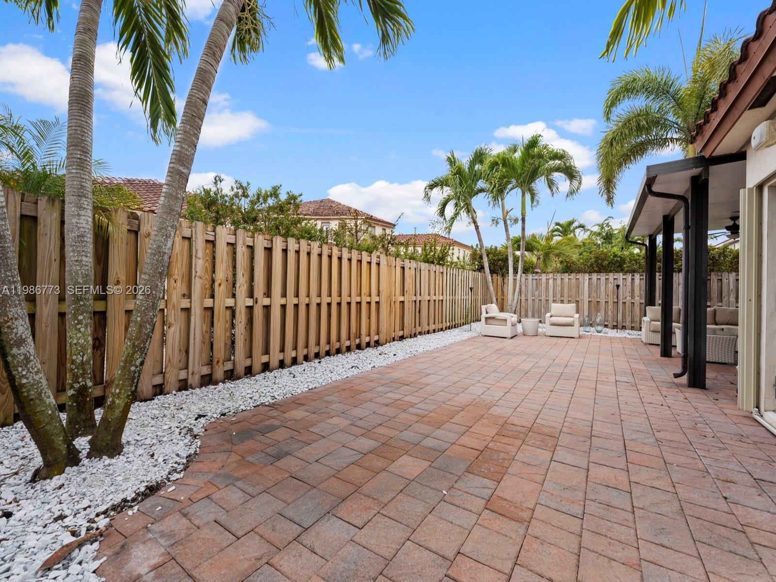 15404 Southwest 175th Street Miami, FL 33187 - Photo 28 of 38 a view of entryway with wooden fence