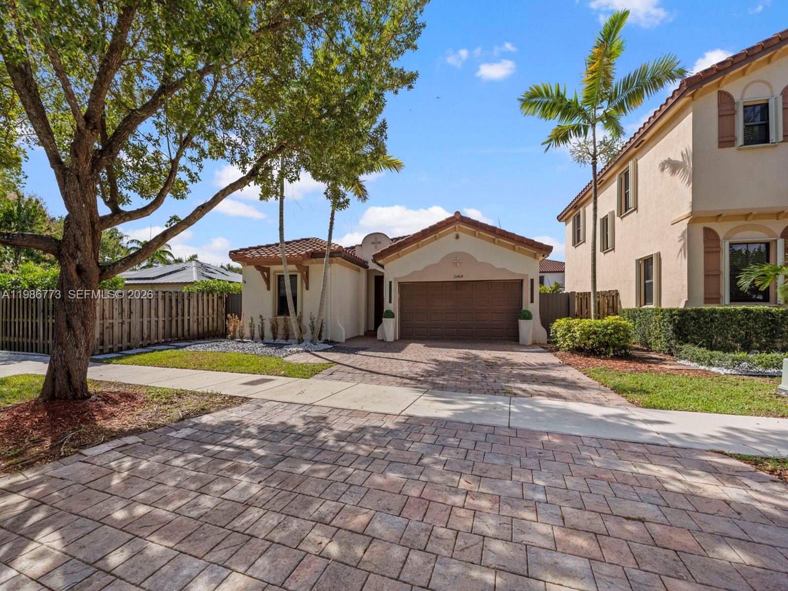 15404 Southwest 175th Street Miami, FL 33187 - Photo 3 of 38 a house with swimming pool in front of it