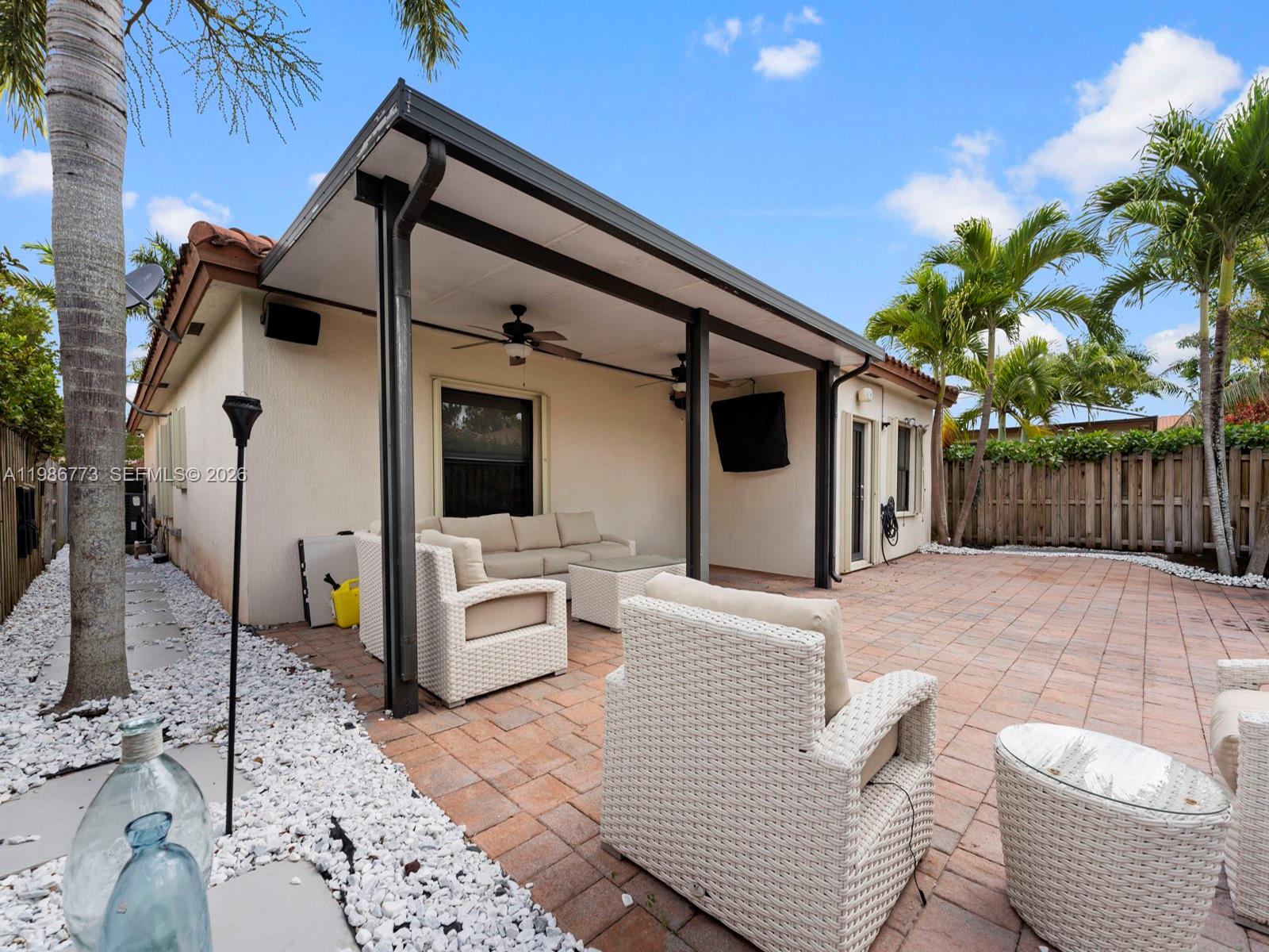 15404 Southwest 175th Street Miami, FL 33187 - Photo 31 of 38 a outdoor space with patio couch and furniture