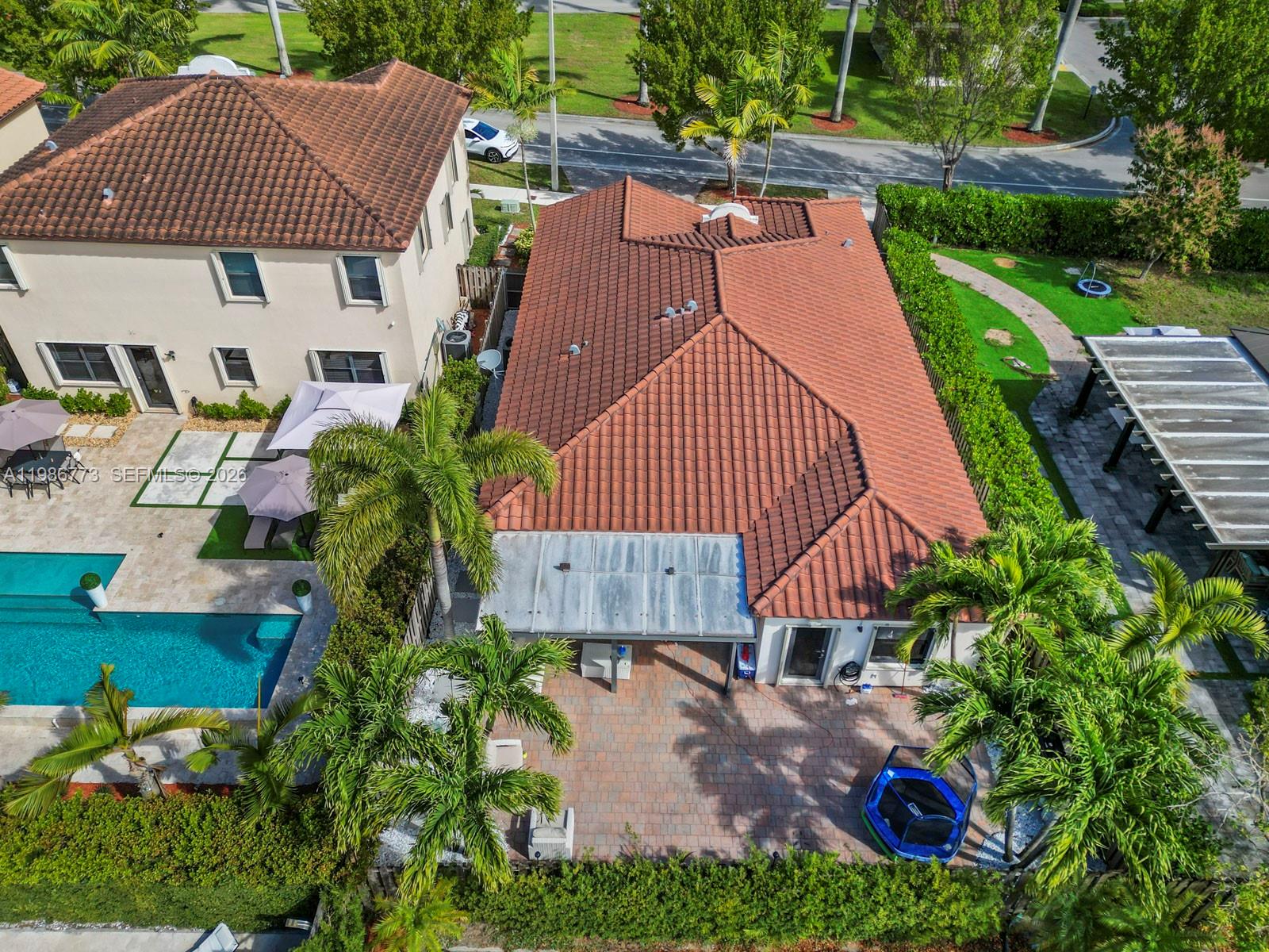 15404 Southwest 175th Street Miami, FL 33187 - Photo 32 of 38 an aerial view of a house with a yard