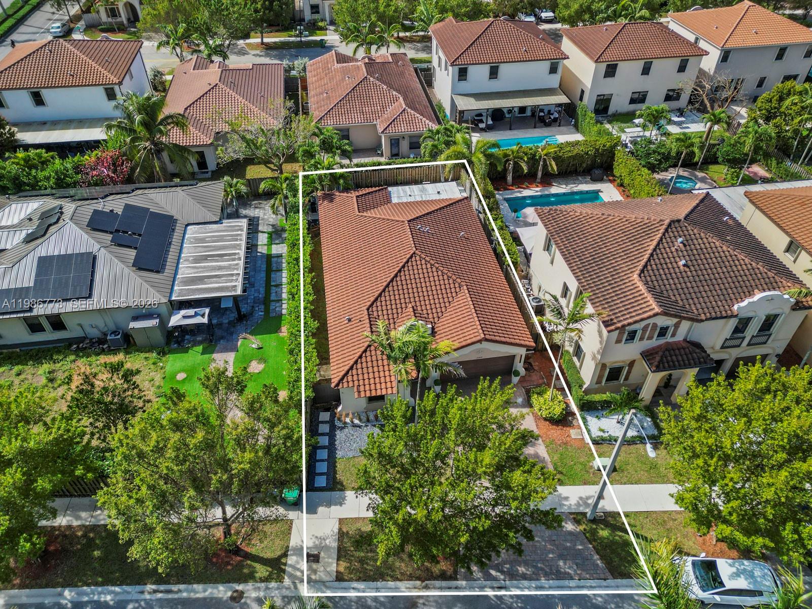 15404 Southwest 175th Street Miami, FL 33187 - Photo 34 of 38 an aerial view of multiple houses with yard