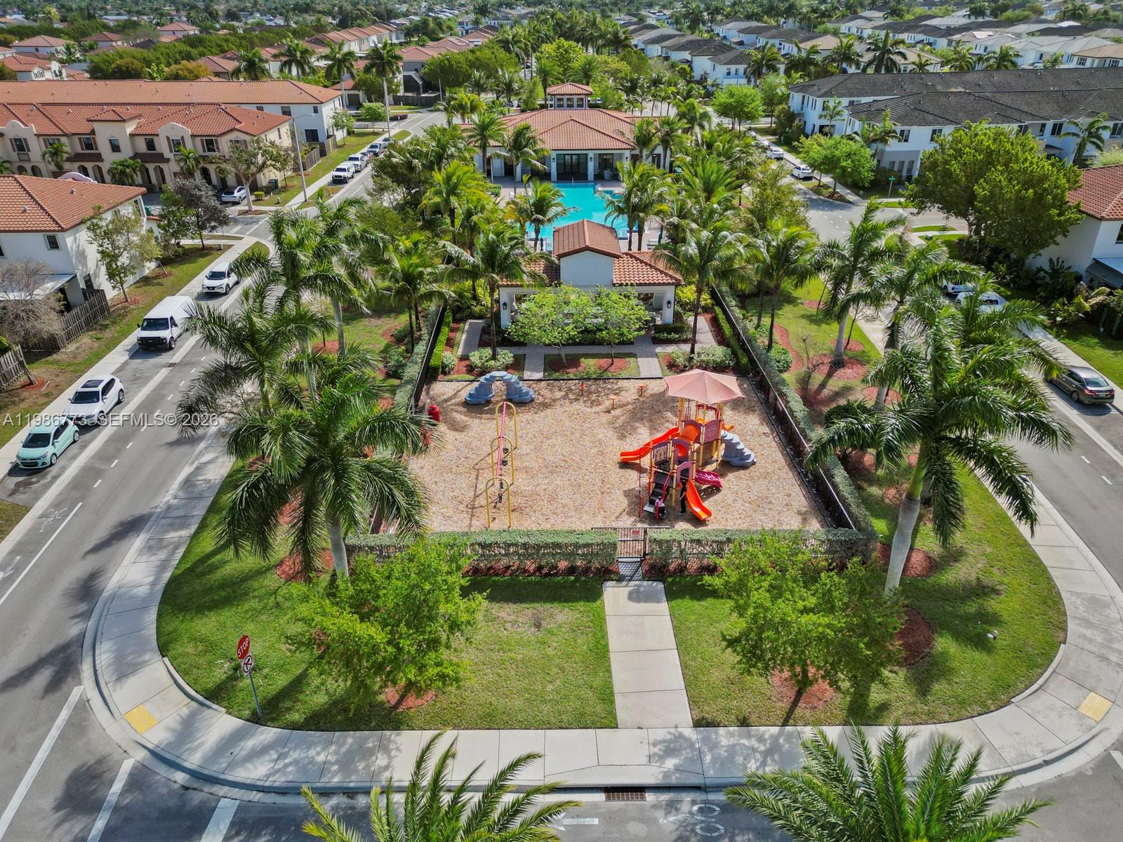 15404 Southwest 175th Street Miami, FL 33187 - Photo 37 of 38 an aerial view of a house with a garden and swimming pool