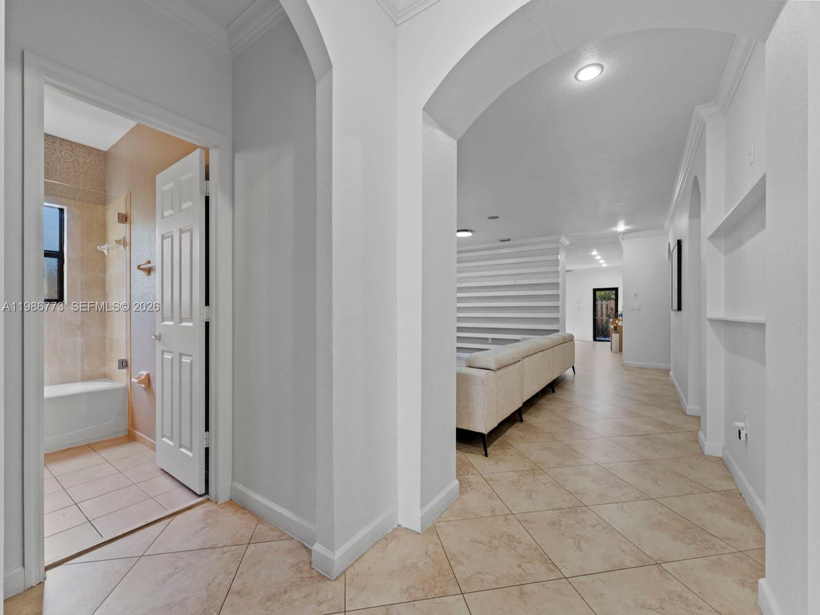 15404 Southwest 175th Street Miami, FL 33187 - Photo 4 of 38 a view of a walk in closet and a bathroom