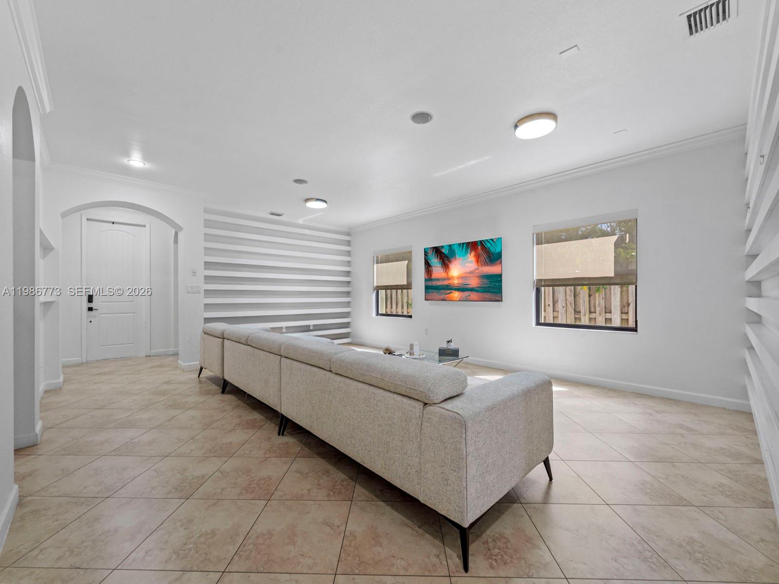 15404 Southwest 175th Street Miami, FL 33187 - Photo 7 of 38 a living room with furniture and a window