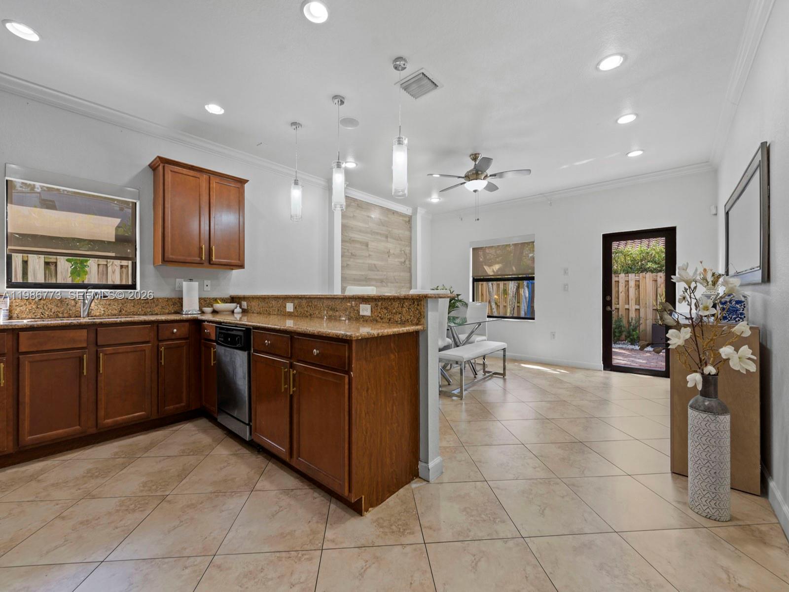 15404 Southwest 175th Street Miami, FL 33187 - Photo 9 of 38 a kitchen with a sink counter top space and appliances