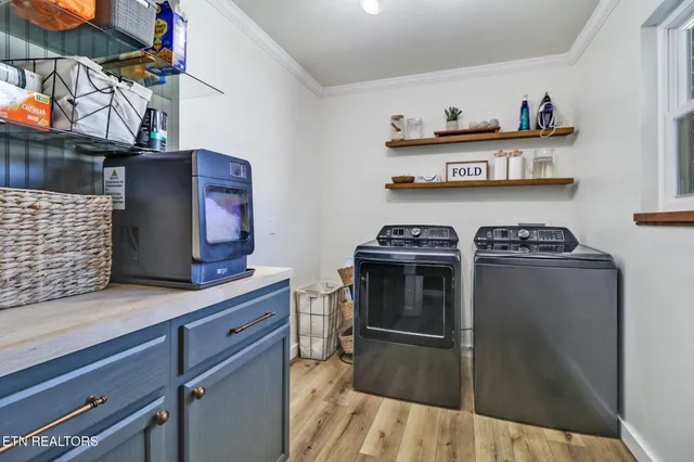 a kitchen with stainless steel appliances a stove and cabinets