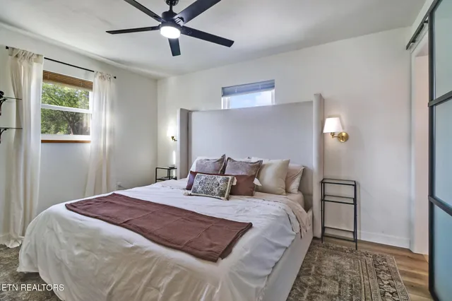 a bedroom with a bed and window