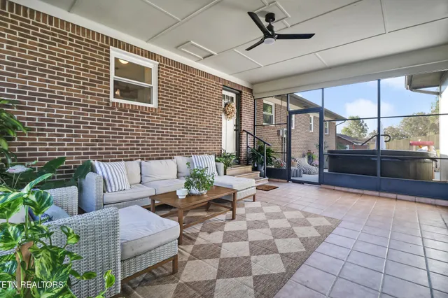 a outdoor space with patio furniture and a fireplace