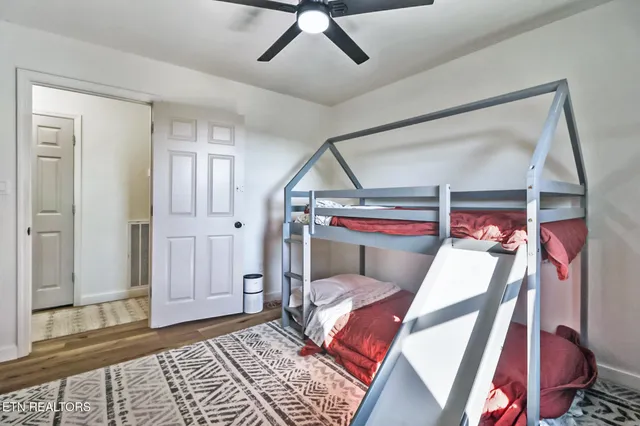 a bed room with a bed and a window