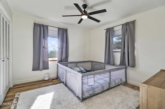 a bedroom with a bed and window