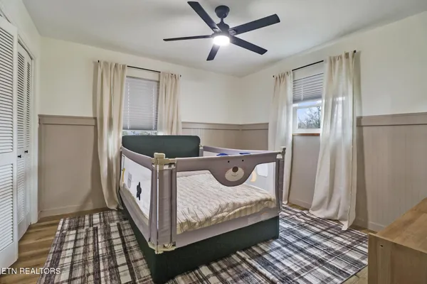 a bedroom with a bed and a closet