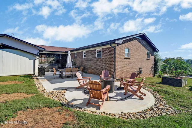 a view of a backyard with sitting area