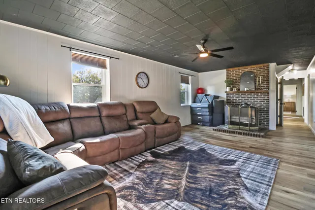 a living room with furniture and a fireplace